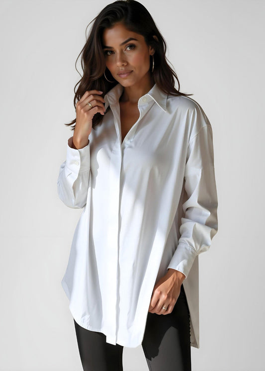 Woman wearing a white shirt against a plain background